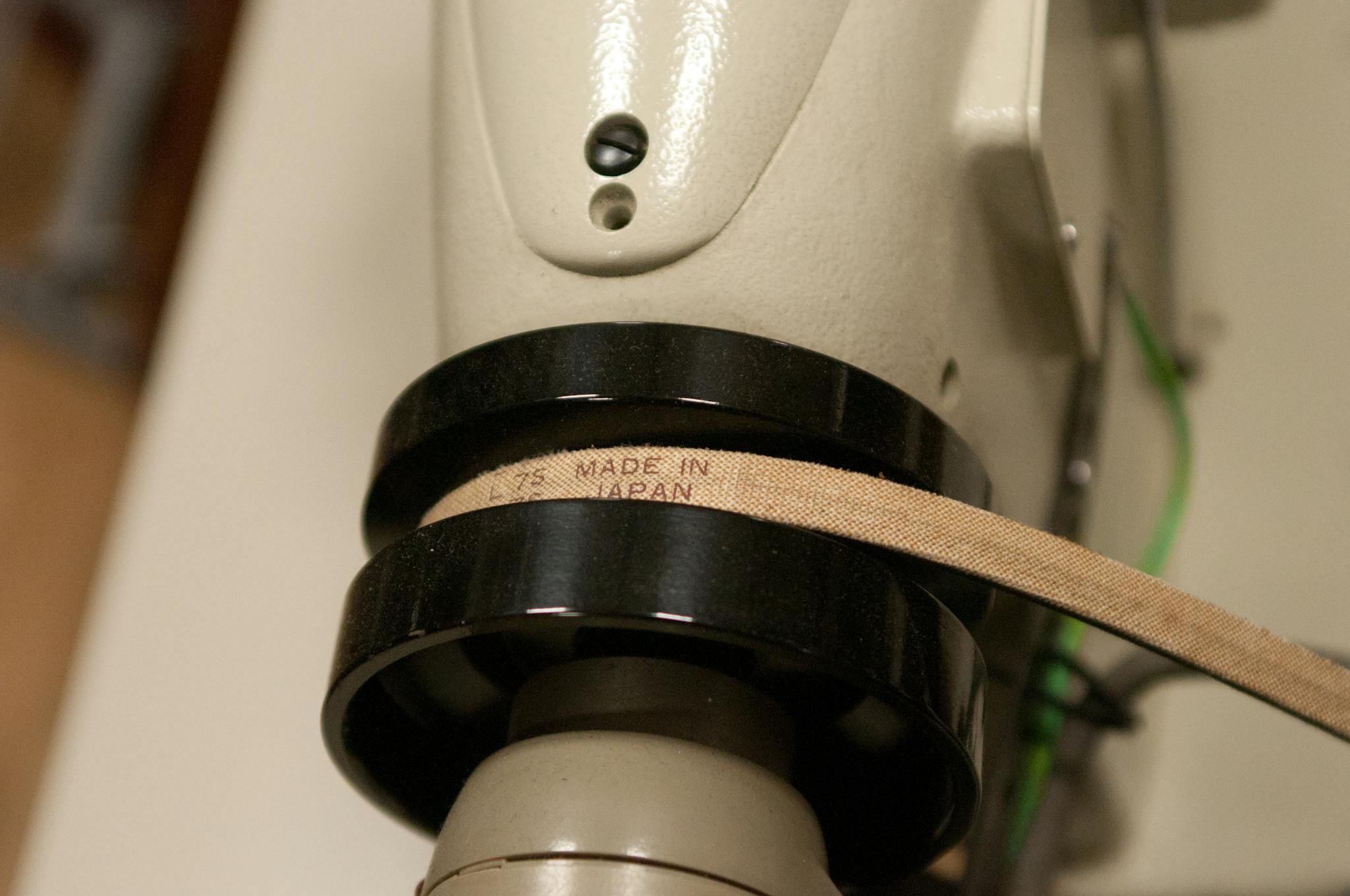 Detailed view of an industrial machine part labeled 'Made in Japan'.